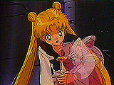 Usagi holding a fading Sailor Chibi Moon